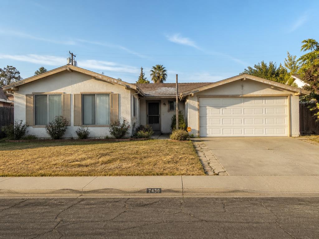 Home with visibly faded washed-out exterior paint and worn trim